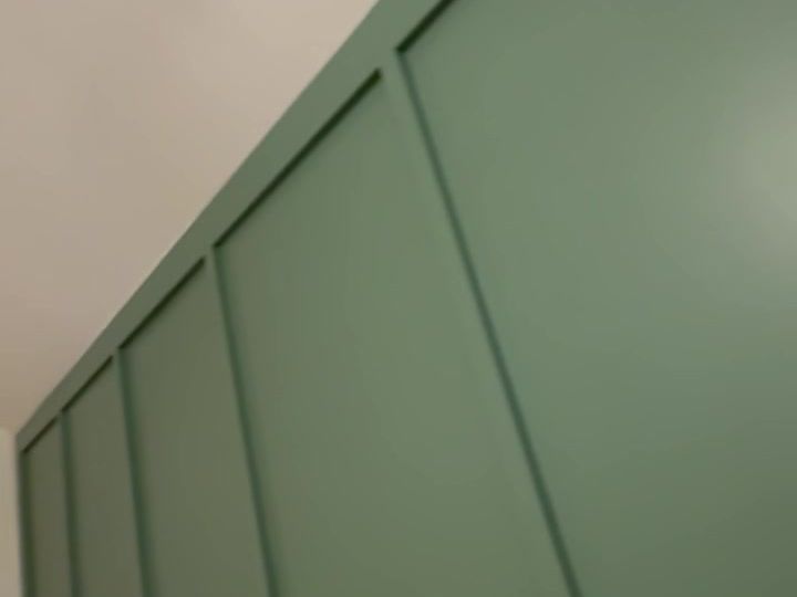 Board-and-batten accent wall painted green